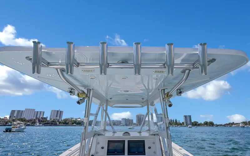  Yacht Photos Pics Invincible 39 boat, 2016 model, on water with city skyline in background.