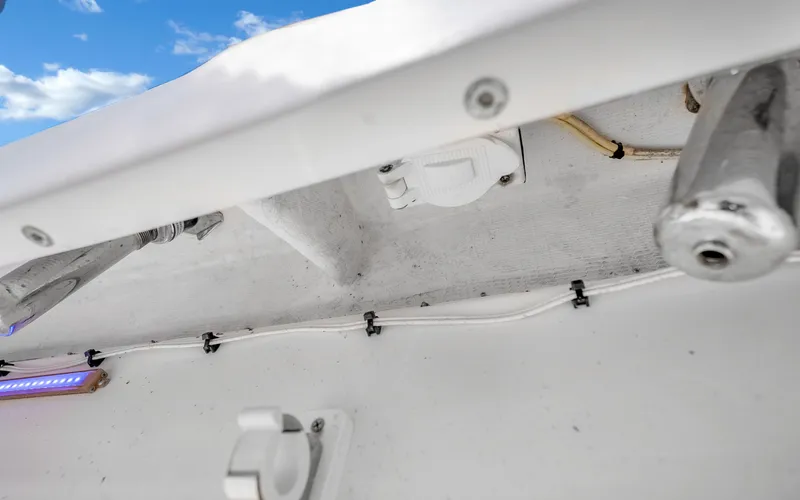  Yacht Photos Pics 2016 Invincible 39 boat interior with wiring and fixtures against a blue sky.