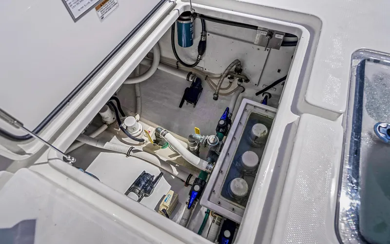  Yacht Photos Pics Engine compartment of 2016 Invincible 39 boat, showcasing mechanical components and wiring.