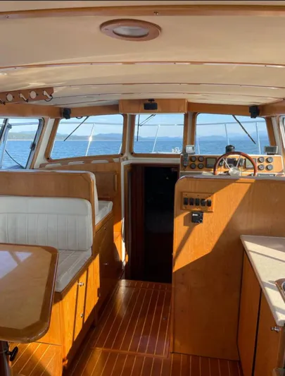  Yacht Photos Pics Interior of 2007 Coastal Craft 36 Cruiser with wooden finishes and ocean view.