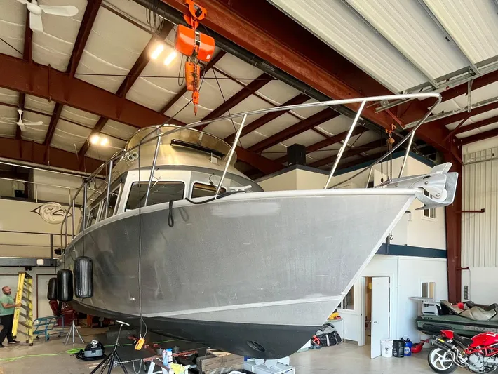  Yacht Photos Pics 2007 Coastal Craft 36 Cruiser in a boatyard, suspended for maintenance.