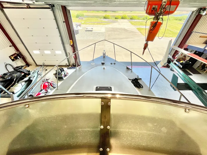  Yacht Photos Pics 2007 Coastal Craft 36 Cruiser in a garage, viewed from above, showcasing the bow and surrounding equipment.