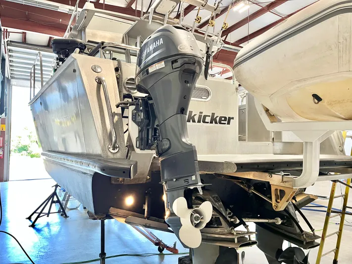  Yacht Photos Pics 2007 Coastal Craft 36 Cruiser with Yamaha outboard motor in a workshop setting.