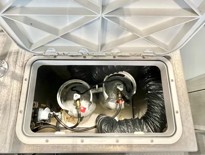  Yacht Photos Pics Open compartment with gas cylinders in a 2007 Coastal Craft 36 Cruiser.