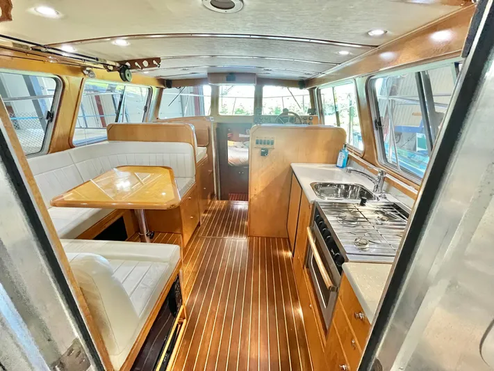  Yacht Photos Pics Interior of a 2007 Coastal Craft 36 Cruiser with wood finishes and modern amenities.