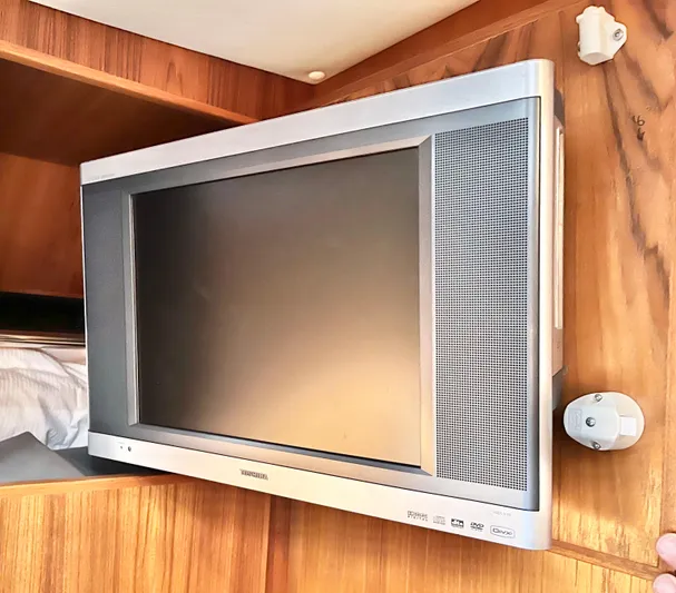  Yacht Photos Pics Wall-mounted TV inside 2007 Coastal Craft 36 Cruiser yacht interior.