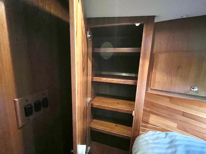  Yacht Photos Pics Interior of 2007 Coastal Craft 36 Cruiser showing wooden storage shelves.