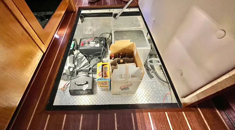  Yacht Photos Pics Storage compartment in 2007 Coastal Craft 36 Cruiser with various items and equipment.