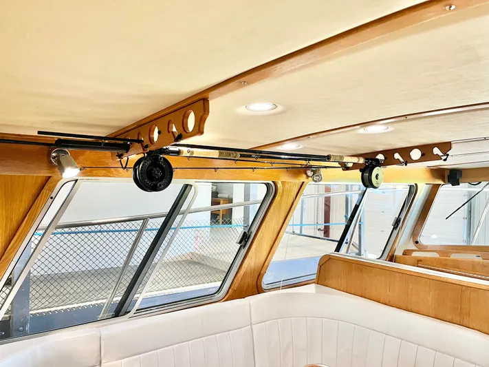 Yacht Photos Pics Interior of 2007 Coastal Craft 36 Cruiser with wood accents and rod holders.