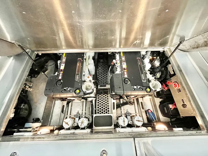  Yacht Photos Pics Engine compartment of a 2007 Coastal Craft 36 Cruiser, showcasing dual engines and mechanical components.