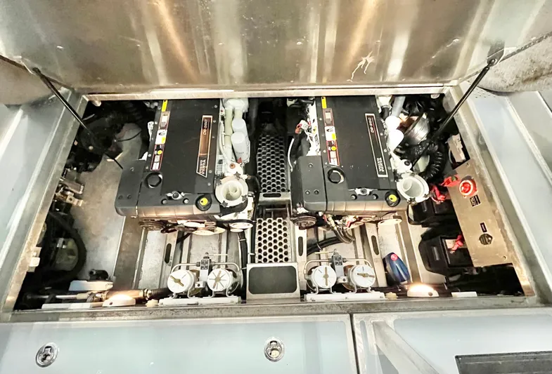  Yacht Photos Pics Engine compartment of a 2007 Coastal Craft 36 Cruiser, showcasing dual engines and mechanical components.