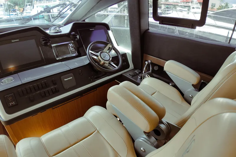 Incognito Yacht Photos Pics Luxurious 2016 Sea Ray L590 Fly yacht cockpit with modern controls and plush seating.