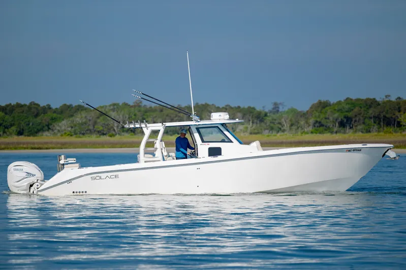  Yacht Photos Pics 2022 Solace 41 CS boat cruising on calm water with scenic background.