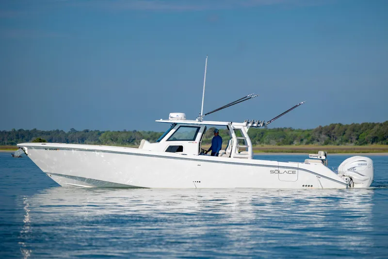  Yacht Photos Pics 2022 Solace 41 CS boat on calm water, side view with clear sky.