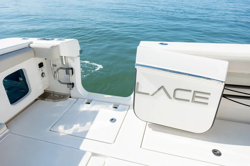  Yacht Photos Pics 2022 Solace 41 CS boat stern with open transom door on calm water.