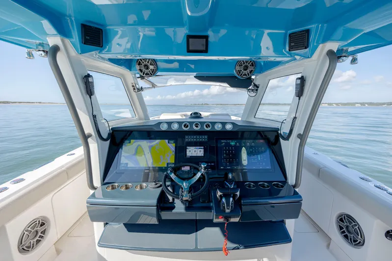  Yacht Photos Pics 2022 Solace 41 CS boat helm with advanced navigation displays and controls.
