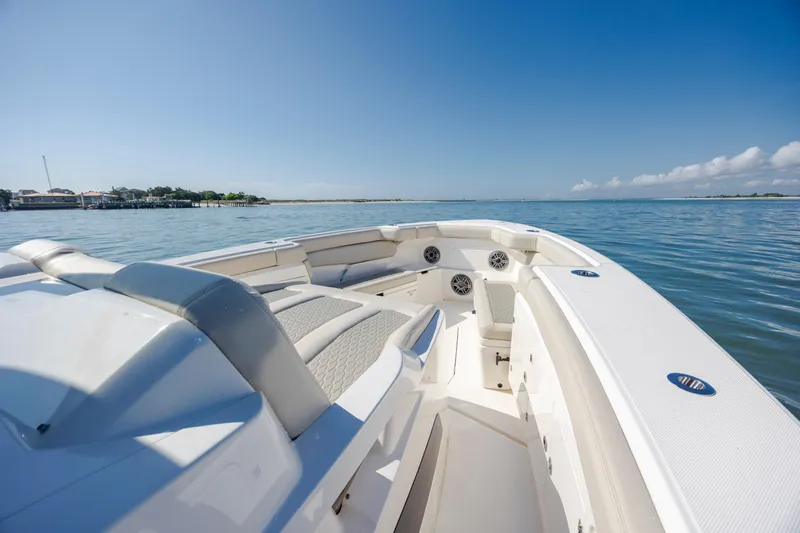  Yacht Photos Pics 2022 Solace 41 CS boat on calm water, featuring spacious seating and clear blue sky.