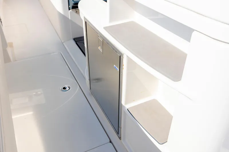  Yacht Photos Pics 2022 Solace 41 CS boat interior with stainless steel storage and white shelving.