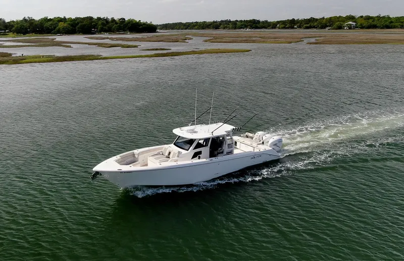  Yacht Photos Pics 2022 Solace 41 CS boat cruising on a scenic waterway.