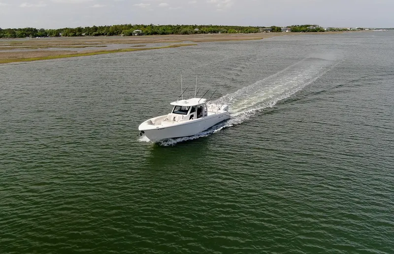  Yacht Photos Pics 2022 Solace 41 CS boat cruising on a calm waterway.