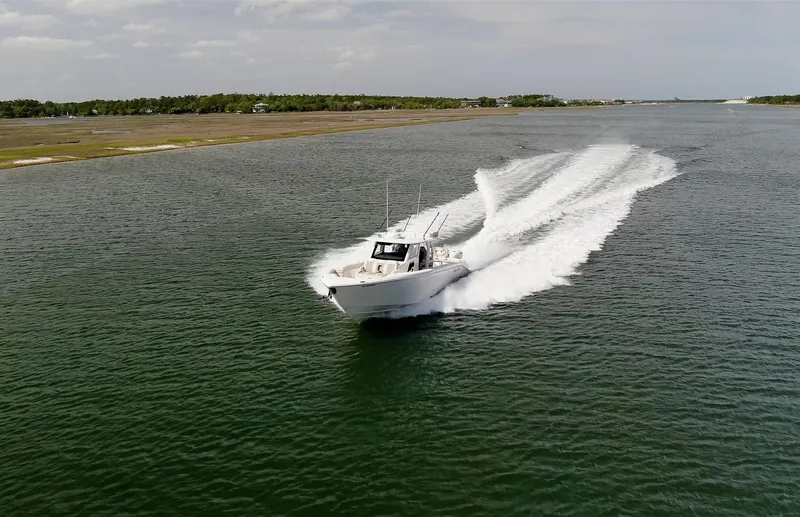  Yacht Photos Pics 2022 Solace 41 CS boat cruising on open water, leaving a wake behind.