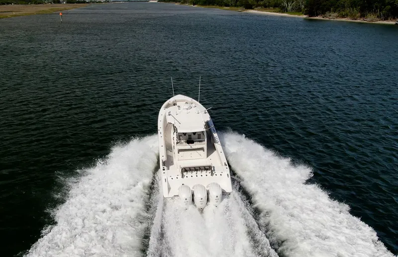  Yacht Photos Pics 2022 Solace 41 CS boat cruising on a scenic waterway.