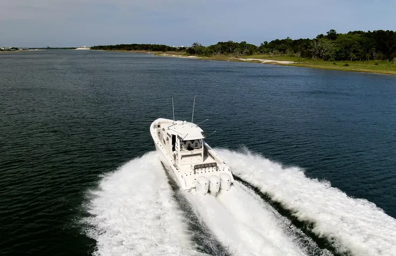  Yacht Photos Pics 2022 Solace 41 CS boat cruising on a scenic waterway.