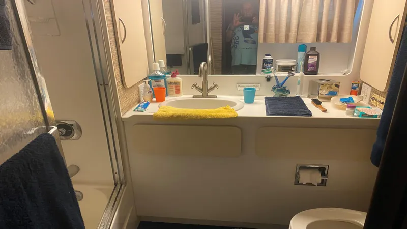  Yacht Photos Pics Bathroom interior of 1987 Hatteras 58 Motor Yacht with toiletries and shower.