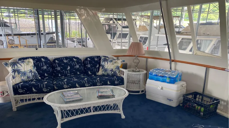  Yacht Photos Pics Interior of 1987 Hatteras 58 Motor Yacht with cozy seating and nautical decor.