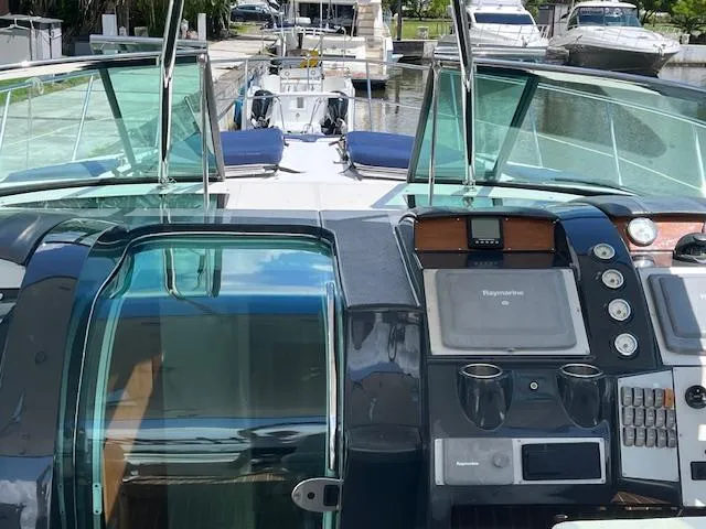 Alacrity Yacht Photos Pics 2008 Doral Mediterra yacht cockpit with modern navigation controls and glass doors.