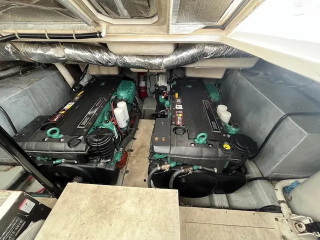 Alacrity Yacht Photos Pics Engine compartment of a 2008 Doral Mediterra boat, featuring dual engines and insulated surroundings.