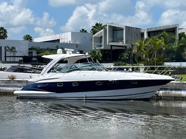 Alacrity Yacht Photos Pics 2008 Doral Mediterra yacht docked by modern waterfront homes.