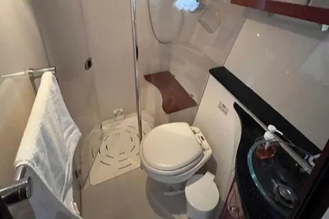 Alacrity Yacht Photos Pics 2008 Doral Mediterra boat bathroom with shower, toilet, and sink.