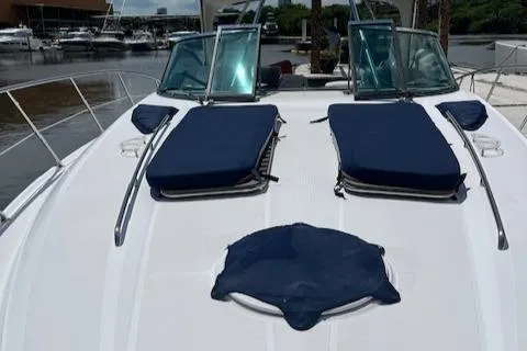 Alacrity Yacht Photos Pics 2008 Doral Mediterra yacht with blue sun pads on deck, docked at marina.