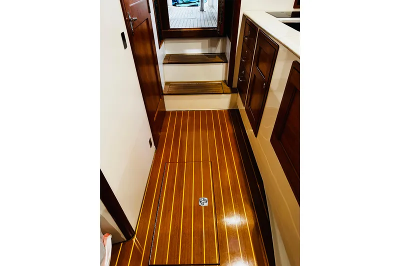By The Way Yacht Photos Pics 2015 MJM 36z Express interior with polished wooden flooring and cabinetry.