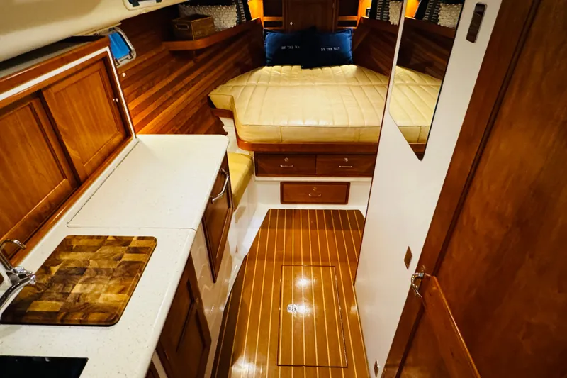 By The Way Yacht Photos Pics Luxurious interior of 2015 MJM 36z Express yacht with wood finishes and cozy cabin.