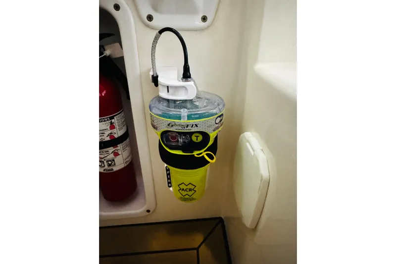 By The Way Yacht Photos Pics Safety equipment on 2015 MJM 36z Express boat, featuring ACR GlobalFix EPIRB and fire extinguisher.