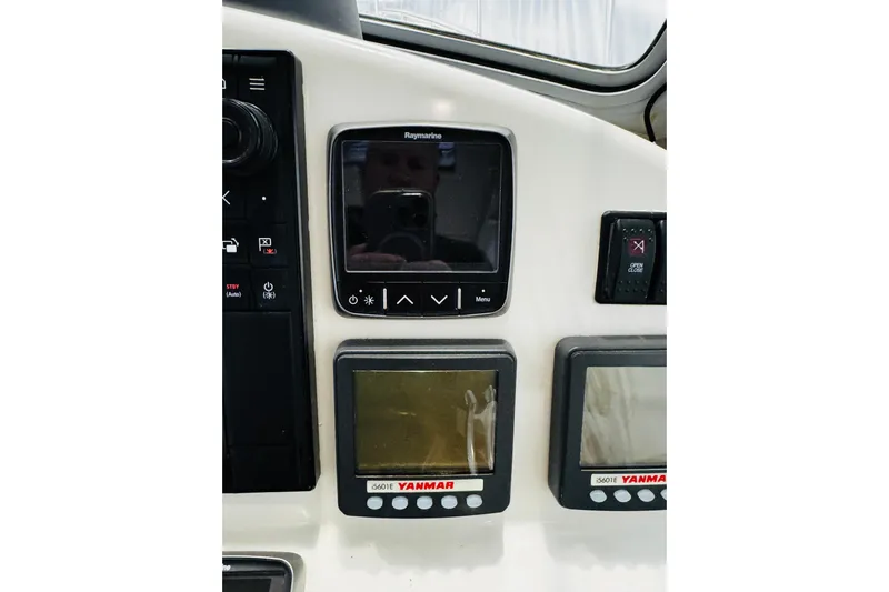 By The Way Yacht Photos Pics Control panel of a 2015 MJM 36z Express boat with Raymarine and Yanmar displays.