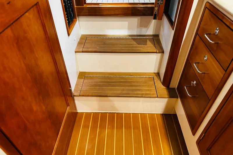 By The Way Yacht Photos Pics Interior of 2015 MJM 36z Express yacht with wooden steps and cabinetry.