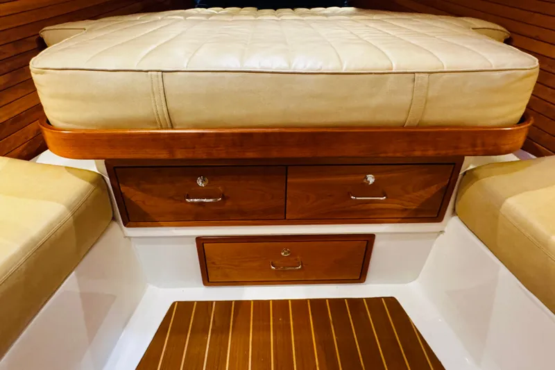 By The Way Yacht Photos Pics Interior of 2015 MJM 36z Express with wooden drawers and cushioned seating.
