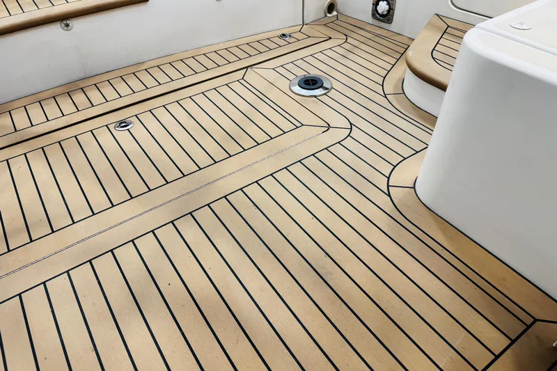 By The Way Yacht Photos Pics Teak deck of 2015 MJM 36z Express boat, showcasing elegant wood pattern and craftsmanship.