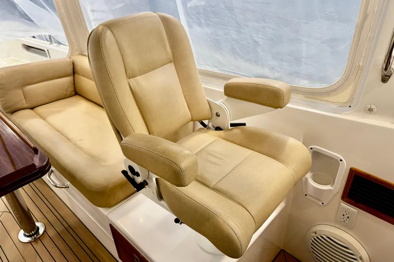 By The Way Yacht Photos Pics Captain's chair and seating area on 2015 MJM 36z Express boat interior.