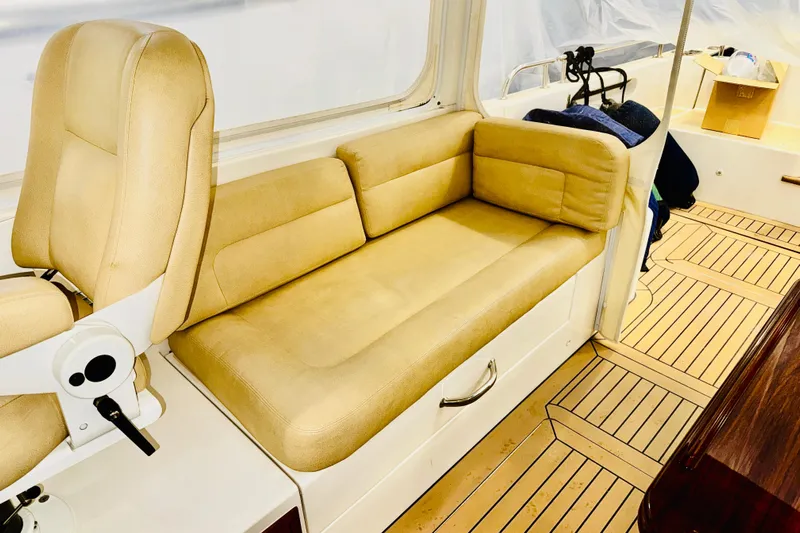 By The Way Yacht Photos Pics 2015 MJM 36z Express interior with beige seating and wooden flooring.