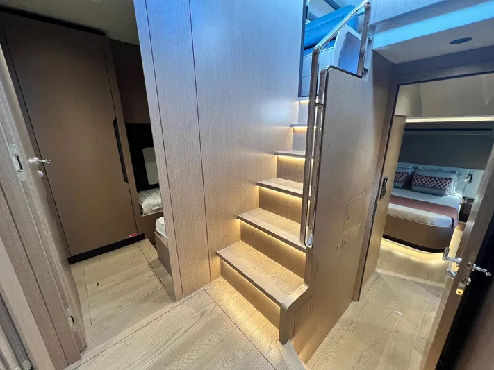  Yacht Photos Pics Luxurious interior of 2024 Sirena 48 Flybridge yacht with wooden stairs and modern design.