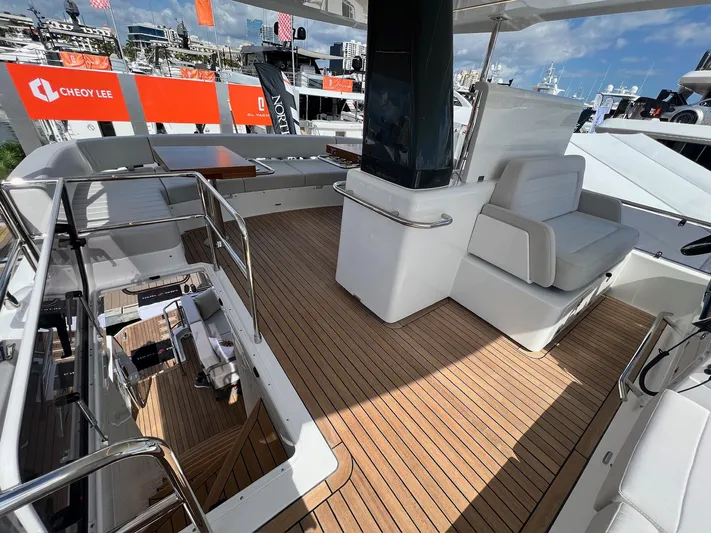  Yacht Photos Pics 2024 Sirena 48 Flybridge yacht interior with teak flooring and modern seating.