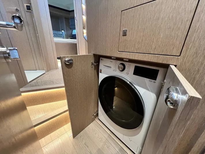  Yacht Photos Pics Laundry area in 2024 Sirena 48 Flybridge yacht with built-in washer.