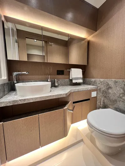  Yacht Photos Pics Luxurious bathroom in 2024 Sirena 48 Flybridge yacht with modern fixtures and elegant design.