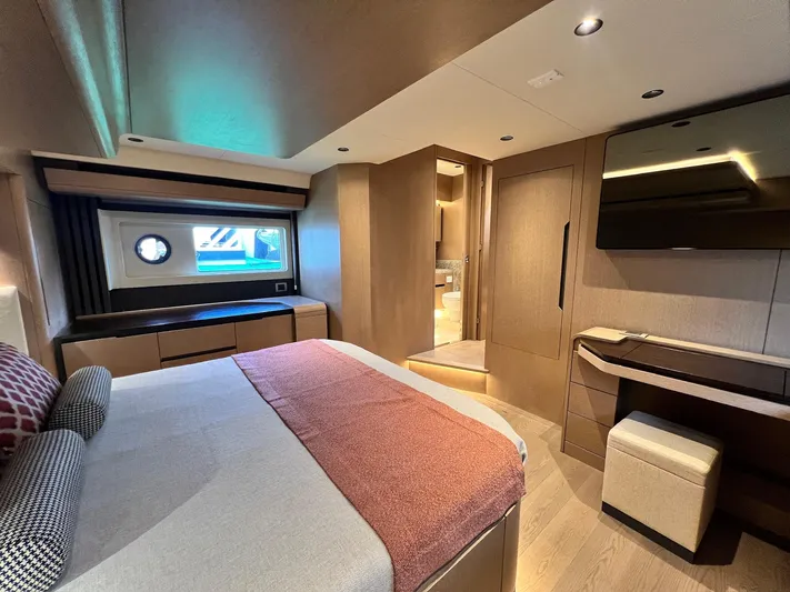  Yacht Photos Pics Luxurious interior of 2024 Sirena 48 Flybridge yacht bedroom with modern furnishings.