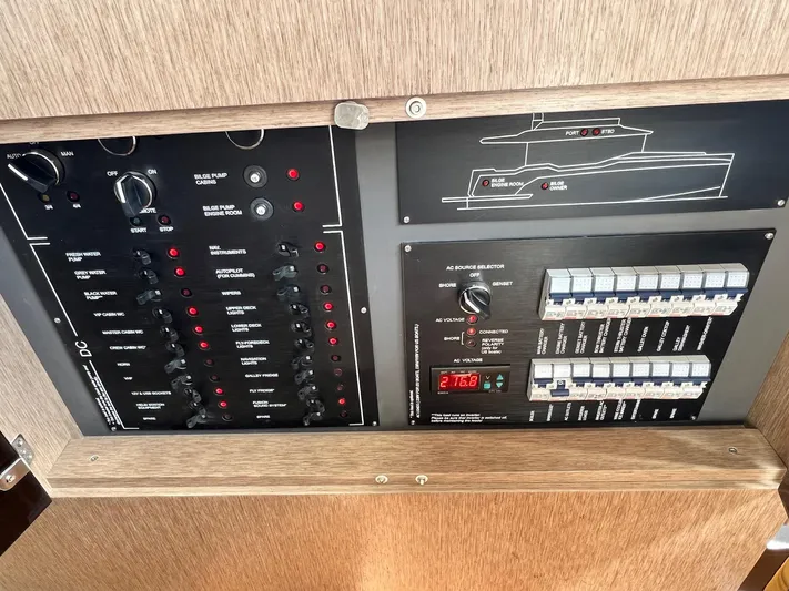  Yacht Photos Pics Electrical control panel of 2024 Sirena 48 Flybridge yacht, featuring switches and circuit breakers.