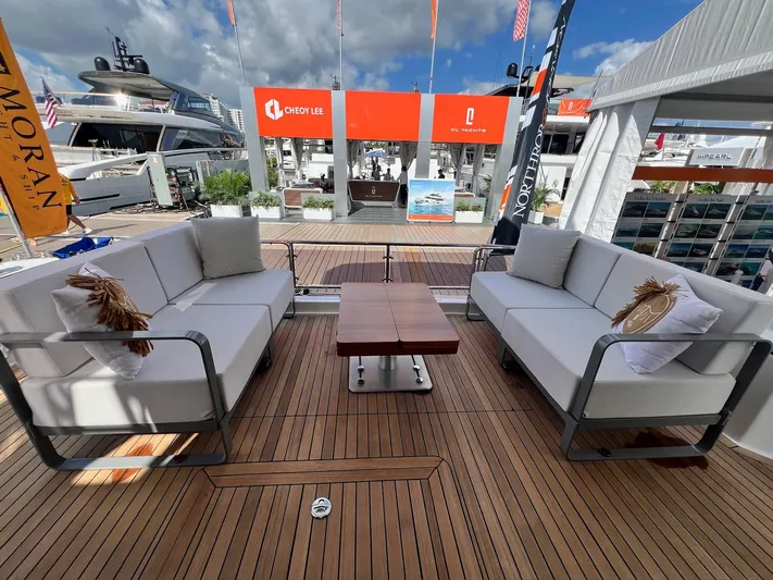  Yacht Photos Pics Luxurious 2024 Sirena 48 Flybridge yacht deck with elegant seating and wooden flooring.